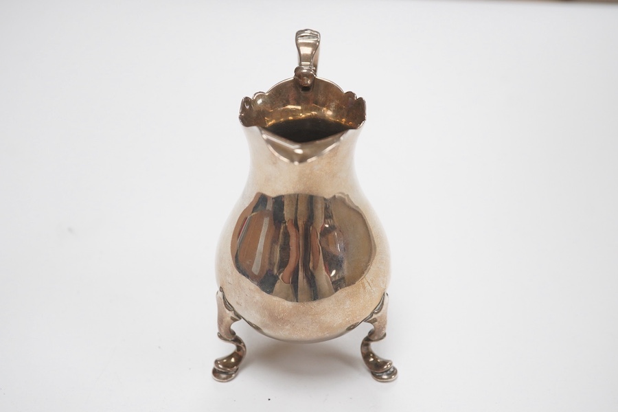 A mid 18th century silver cream jug, indistinct marks, 92mm, 3.3oz. Condition - fair